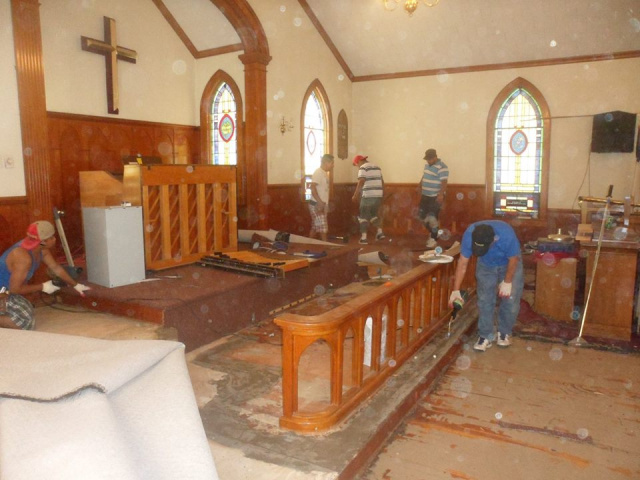 Removal of old carpet from Ewell Church.  Photo credit Rick Edmund